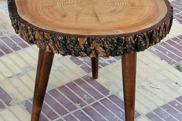 Handcrafted round wood slab side table with natural bark edge for export by WWCEXP